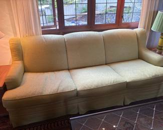 $2400. Custom J & M sofa with skirted detailing. Upholstery name is Anduze, color is Vert. 96 inches wide by 36.5 inches deep by 36 inches high.