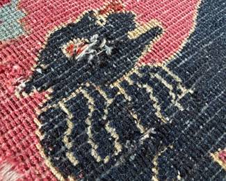 as found on rug - small repair.