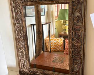 $800. Carved wood with faded red paint. Anglo-Indian mirror. 47"h x 35"w.