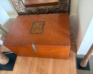 $160. Trunk lined with cedar. Wood frame with skin or leather top. 32" w x 21"d x 17"h.