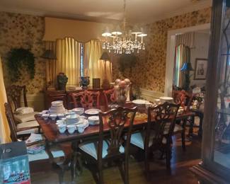 Beautiful dining room table and10 chairs with matching Hutch and sideboard 