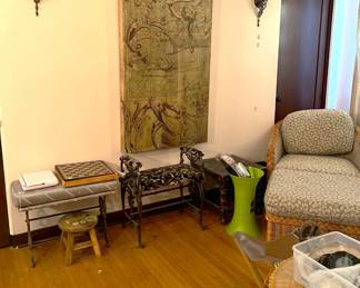 The wall hanging shown here has a lot of flourish to it.  There is also a chessboard here on one of the cushioned bench.