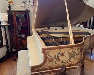 Here is another view of the piano.  It is not large, but still sounds grand!  But the compact size makes it a good choice for smaller spaces.  You can also see some of the panel decoration.