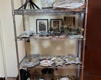 This shelving rack has a table-mounted telescope (buy it before someone else does), along with smaller mirrors and a pair of wall sconces.