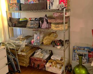 Another rack of various items is seen here, including a number of shoe trees (bottom right of the shelves).