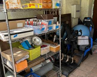 On one side you can see a few exercise equipment pieces, then on the shelves more of household parts and supplies.