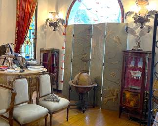 Here we have another overview of the room.  A smaller display cabinet, a pair of matching chairs, the antique globe, a bit of the Baldwin piano, and the privacy screen can be seen.
