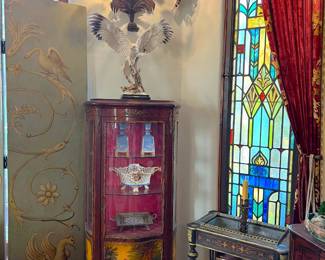 This display cabinet was seen elsewhere in the photos, but here is a better view of it.  Remember to look at the small table in front of the stained glass window.
