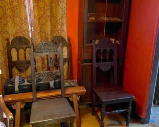 Here you can see a number of matching chairs, a small bench, and the darkwood display cabinet in the corner.