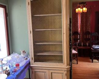 This is one of two mesh-fronted display cabinets that would look good in your house.