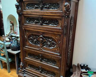 This ornate cabinet will be perfect for storing lots of books or clothing or board games.  Come to the sale to see how it opens up.