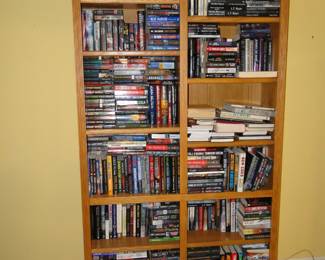 Books, lots and lots and lots of books, a lot of books. The solid wood bookcase is also for sale. And is handmade one of a kind
