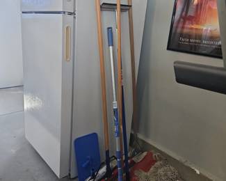 Assorted Janitorial Cleaning Tools and Refrigerator