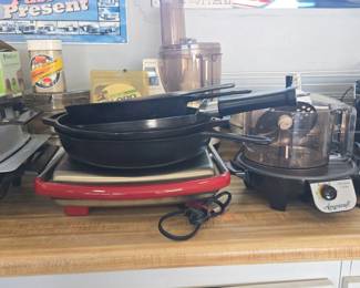 Assorted Cast Iron Skillets and Americraft AllPurpose Cooker