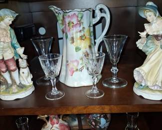 VictorianStyle Porcelain Figural Pair, Floral Pitcher, and Crystal Stemware