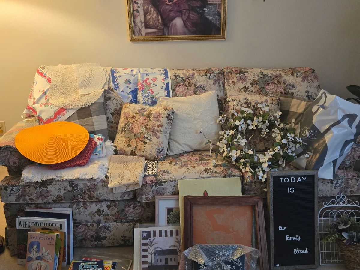 Queen size sleeper sofa, picture frames, artwork, table coverings