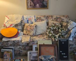 Queen size sleeper sofa, picture frames, artwork, table coverings