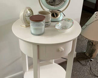 Lot 42: White round end table with vintage fan and assorted decorative items