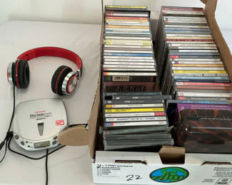 Lot 102: Sony small portable CD player with Headphones, CD's