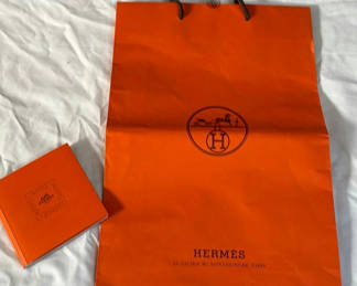 Lot 123: Hermès orange shopping bag and gift box