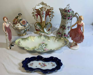 Lot 24: Goebel porcelain figurines with floral vases and dishes