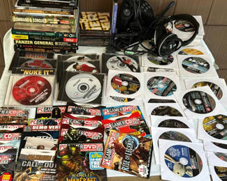 Lot 129: Collection of PC game discs, strategy guides, and magazines