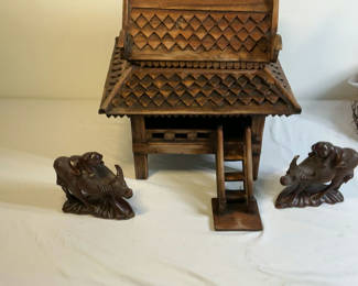 Lot 17: Carved wooden miniature temple with two animal figurines