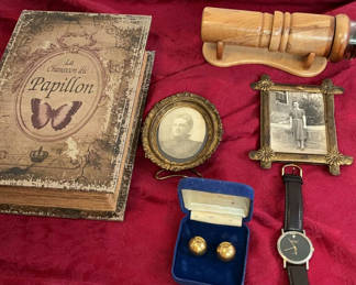 Lot 118: Faux Antique book Box, framed photos, cufflinks, wristwatch, and carved wooden object