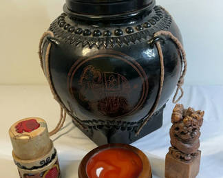 Lot 16: Burmese Black Lacquer pot with carved elephant handle on lid, ceramic Asian stamps
