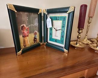 Picture frame with clock and candlesticks with candles
