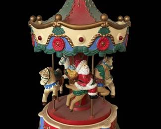 Avon Santas Caroling Carousel Musical Figurine