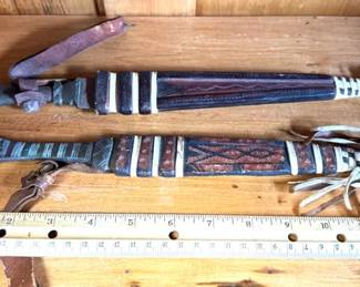 Vintage tribal daggers in leather scabbards