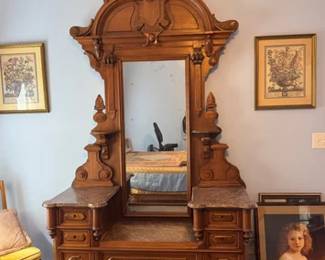 Victorian Renaissance dresser with elaborate details, marble tops and mirror