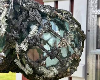 Glass floats or net buoys wrapped in aged rope netting
