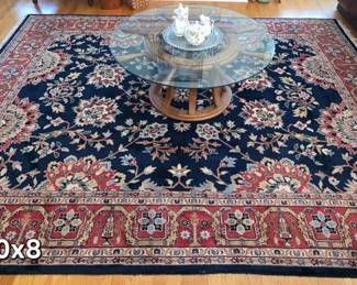 Traditional style oriental area rug, ship's wheel glass top table