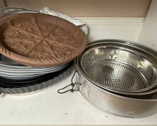 Assorted Bakeware Collection with Springform Pans, Muffin Tins, and Decorative Pie Dish