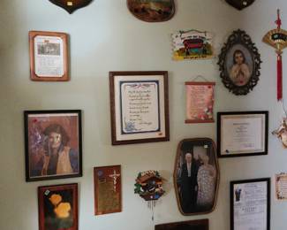 Wall photos and mounted deer antlers