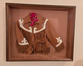 Vintage child's western jacket in display case
