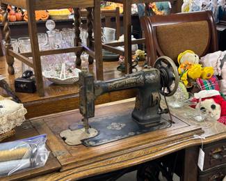 Antique White sewing machine with beautiful cabinet.