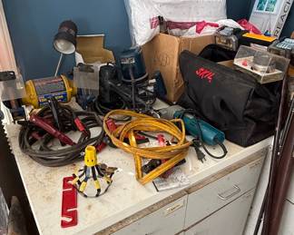 Assorted Power Tools and Workbench with Jumper Cables