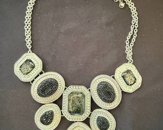 Silver Tone Bib Necklace with Black Faceted Stones and Textured Glitter Accents