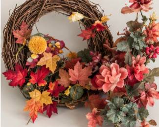 Rustic wreath with artificial flowers.