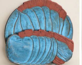 Blue and rust turkey-shaped platters. We prefer to sell these together. 