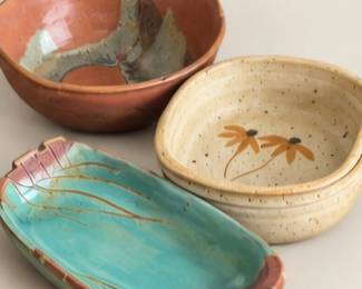 Assorted colorful pottery serving dishes. Sold separately 