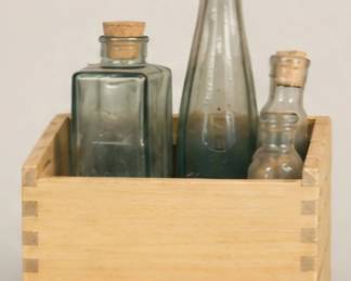 Vintage bottles in wooden holder. Box and bottles all sold separately. 