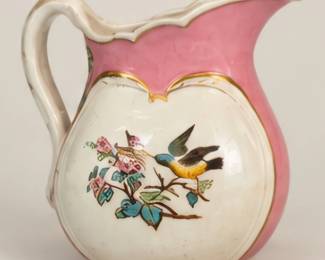 Floral ceramic bird pitcher.
