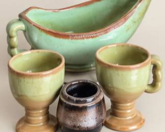 Green pottery gravy boat and cups. Sold separately 