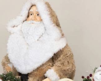 Assorted cream and white Santa figurines. These are not a set.