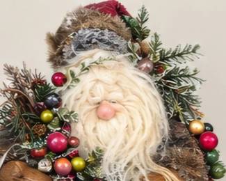Decorative Santa with greenery and ornaments