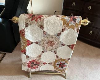 Brass quilt rack with quilt